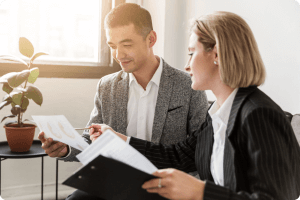 A woman sharing ideas to the man related to a project