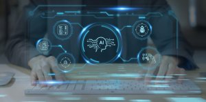 A person types on a white keyboard with a holographic interface overhead. The interface includes icons and graphics related to artificial intelligence, such as a head profile, a flowchart, and a robot. The central graphic features "AI" with circuitry patterns, hinting at government involvement in AI development.