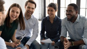 A leader of a group telling funny story to his team