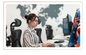 A woman employee, alone in the office doing a serious computer task