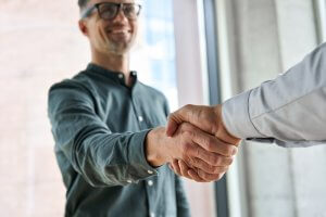 Two professional businessmen leaders shaking hands