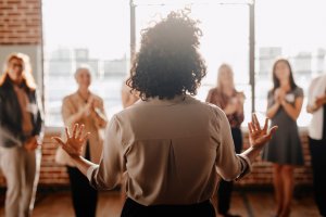 African-american female empowering colleagues in workplace