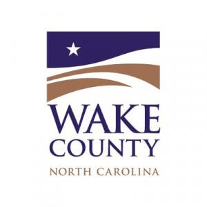 Wake County, North Carolina logo with a blue and brown abstract landscape, a white star, and the words "Wake County North Carolina" beneath the image.