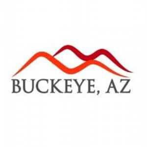Buckeye, AZ logo featuring two stylized mountain shapes in shades of red and orange above the text “BUCKEYE, AZ” in bold, gray capital letters.