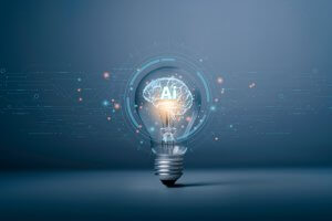 A glowing light bulb with a digital brain and the letters "AI" inside, surrounded by futuristic circuit patterns on a blue background, symbolizing artificial intelligence, workforce transformation, and innovation.