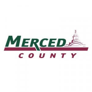 Merced County logo with "Merced" in green text and "County" in maroon below. A maroon outline of a domed building appears above the text on the right side.