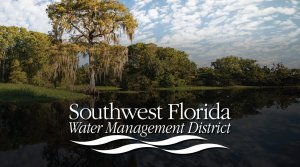 A lake near Orlando is surrounded by trees draped in Spanish moss under a partly cloudy sky, featuring the text "Southwest Florida Water Management District" with stylized wave graphics at the bottom.