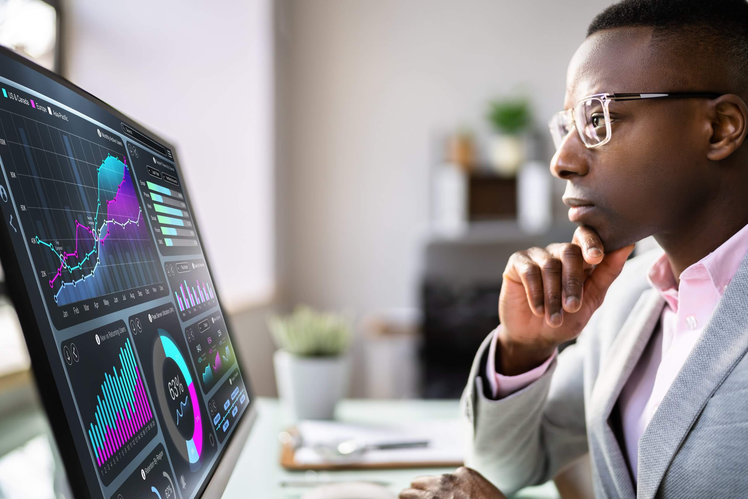 A woman stands by a whiteboard giving a presentation on public sector strategies to five seated colleagues in a modern office with large windows and industrial-style decor.
